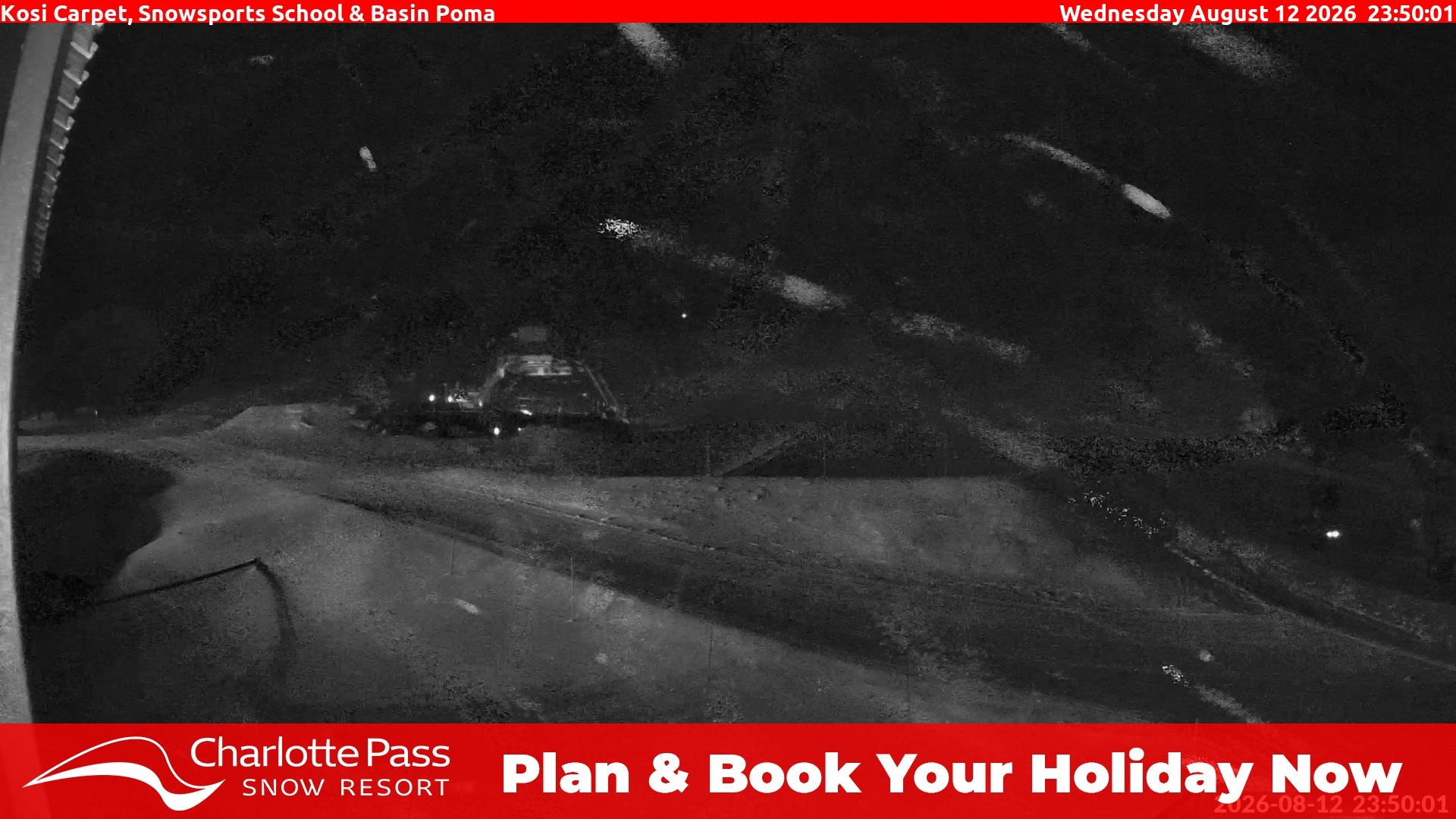 Charlotte Pass Kosi Carpet, Snowsports School and Basin Poma snow cam captured at 12 August 2026 at 11:53 pm AEST