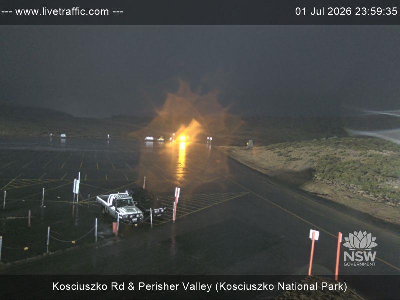 Perisher Perisher Valley Car Park Road snow cam captured at 1 July 2026 at 11:59 pm AEST