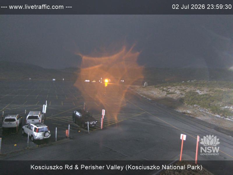 Perisher Perisher Valley Car Park Road snow cam captured at 2 July 2026 at 11:59 pm AEST
