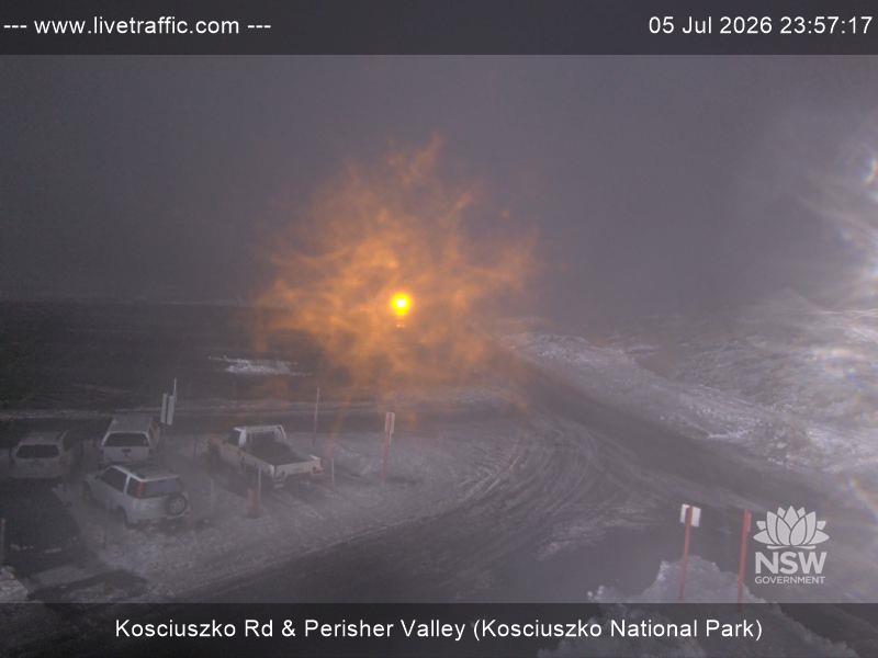Perisher Perisher Valley Car Park Road snow cam captured at 5 July 2026 at 11:57 pm AEST