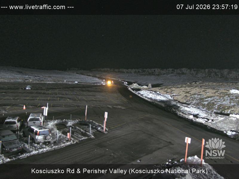 Perisher Perisher Valley Car Park Road snow cam captured at 7 July 2026 at 11:57 pm AEST