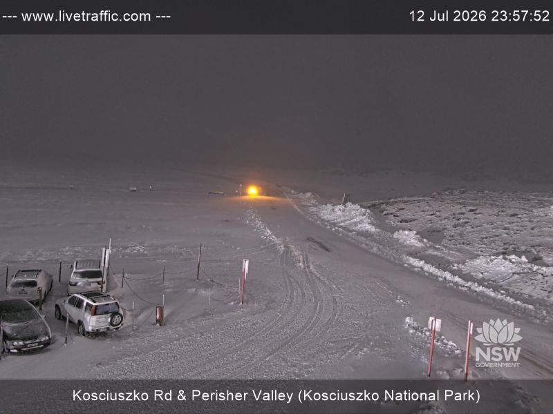 Perisher Perisher Valley Car Park Road snow cam captured at 12 July 2026 at 11:57 pm AEST